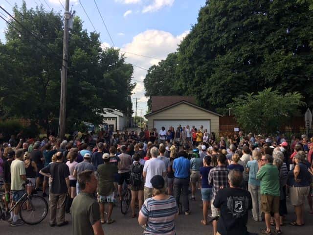 A vigil for Ms Damond attracted hundreds of people.