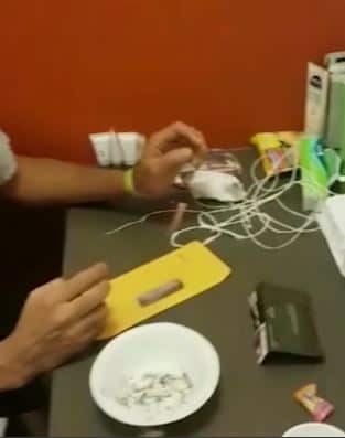 A detainee inside Villawood prepares to smoke ice.