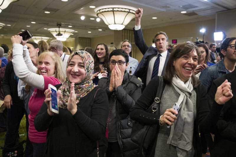 Supporters cheer as they watch returns at an election night party for Democrat congressional candidate Jennifer Wexton.
