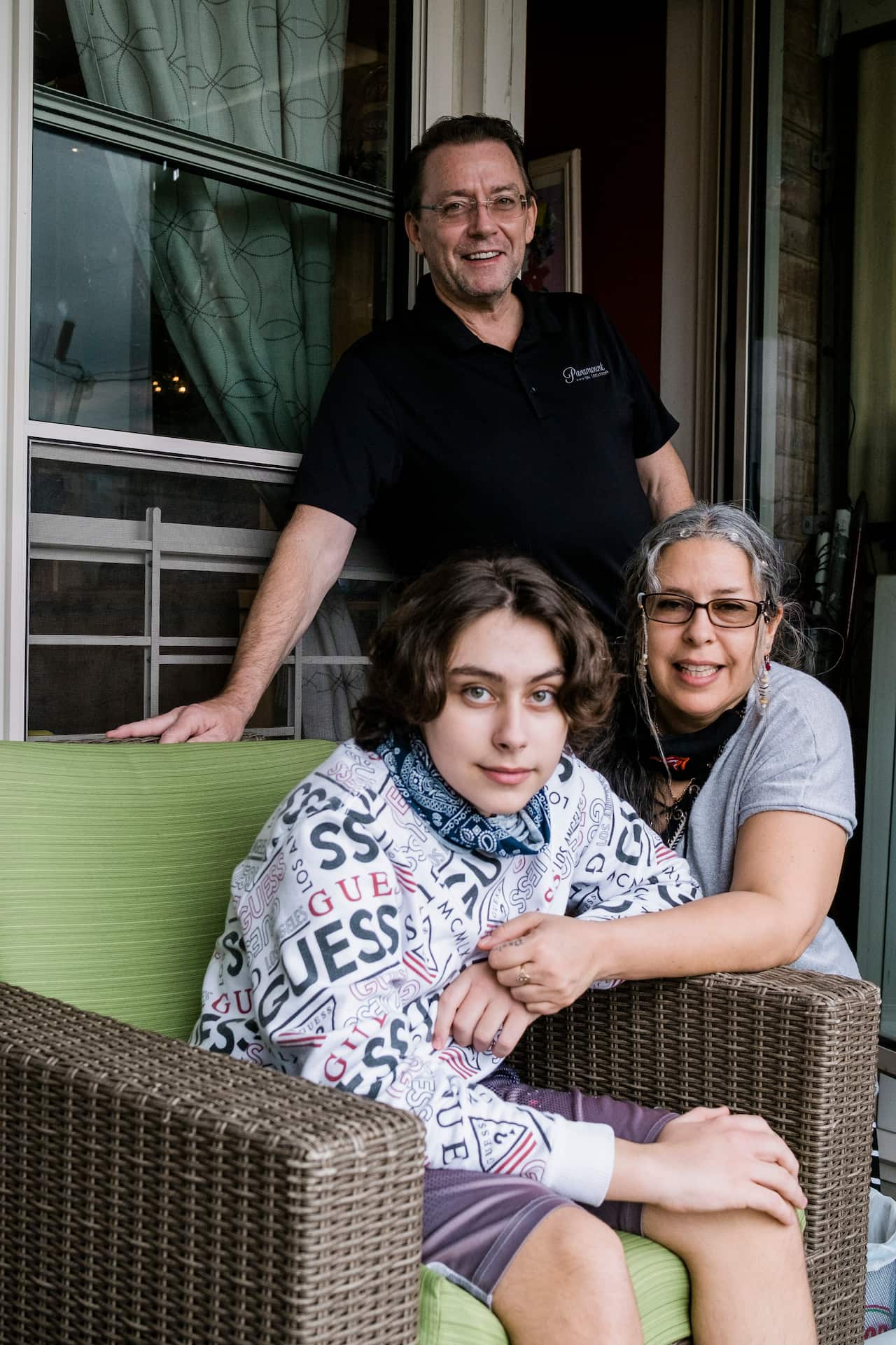 Jack McMorrow, 14, and his parents on the balcony of their home in Queens, 11 May, 2020.