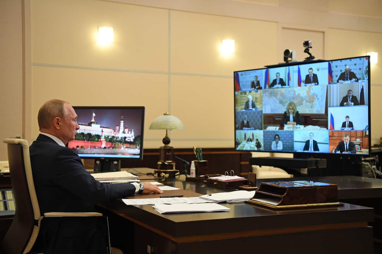 Vladimir Putin chairing a meeting via video conference (AAP)