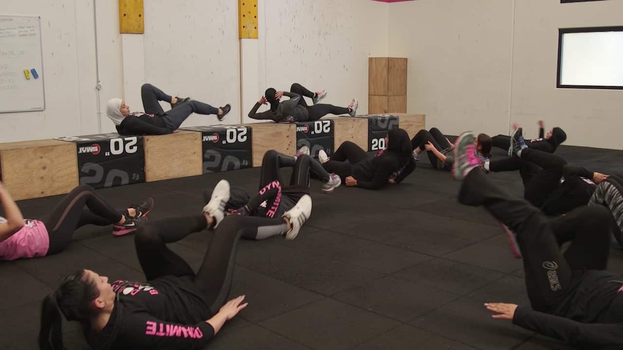 Dalal and her clients exercise in their scarves.