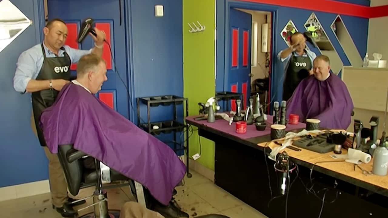 Mayor Gary Johanson gets a haircut from one of the local businesses on Prospect Road.