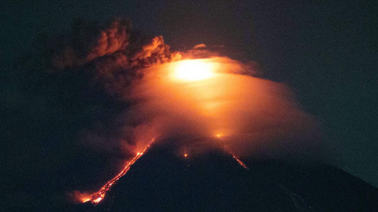 Lava cascades down the slopes of Mayon volcano.