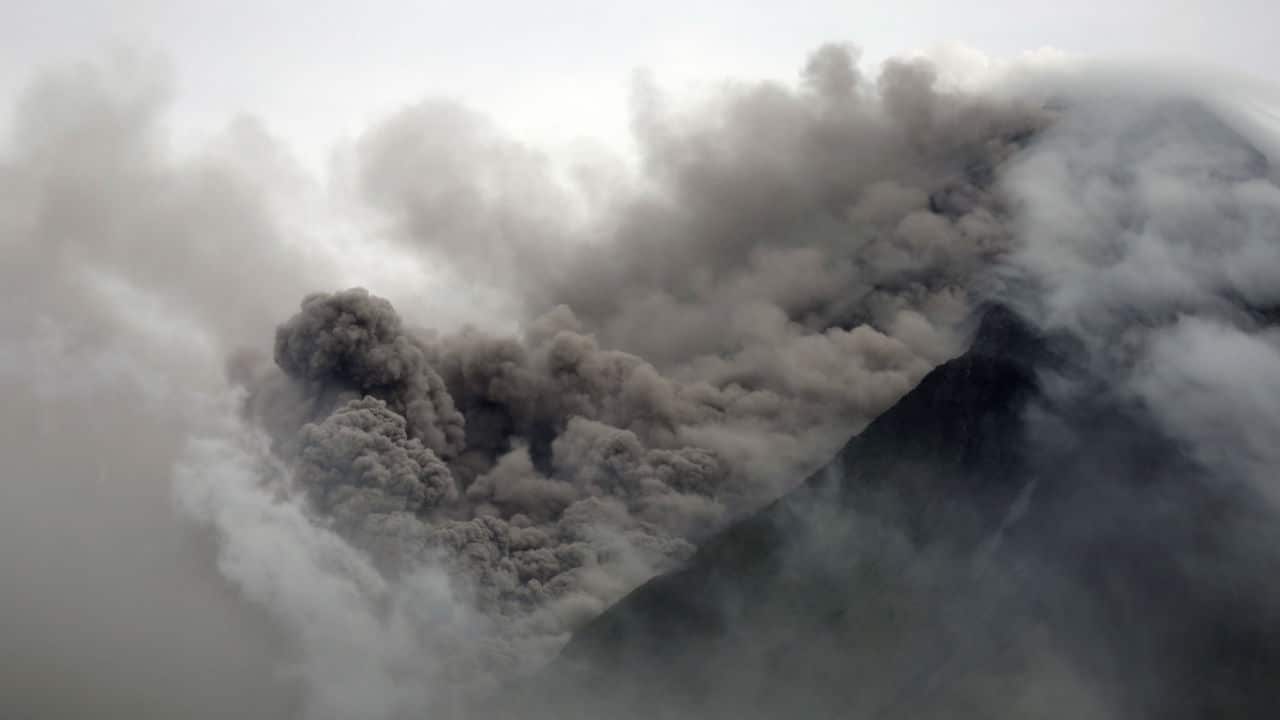 A view of rumbling Mayon Volcano as it spews ash.