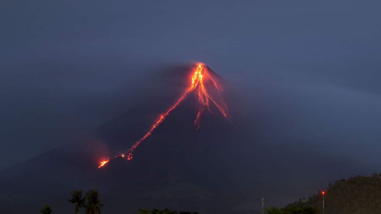 Lava continues to cascade down the slopes of Mayon volcano.