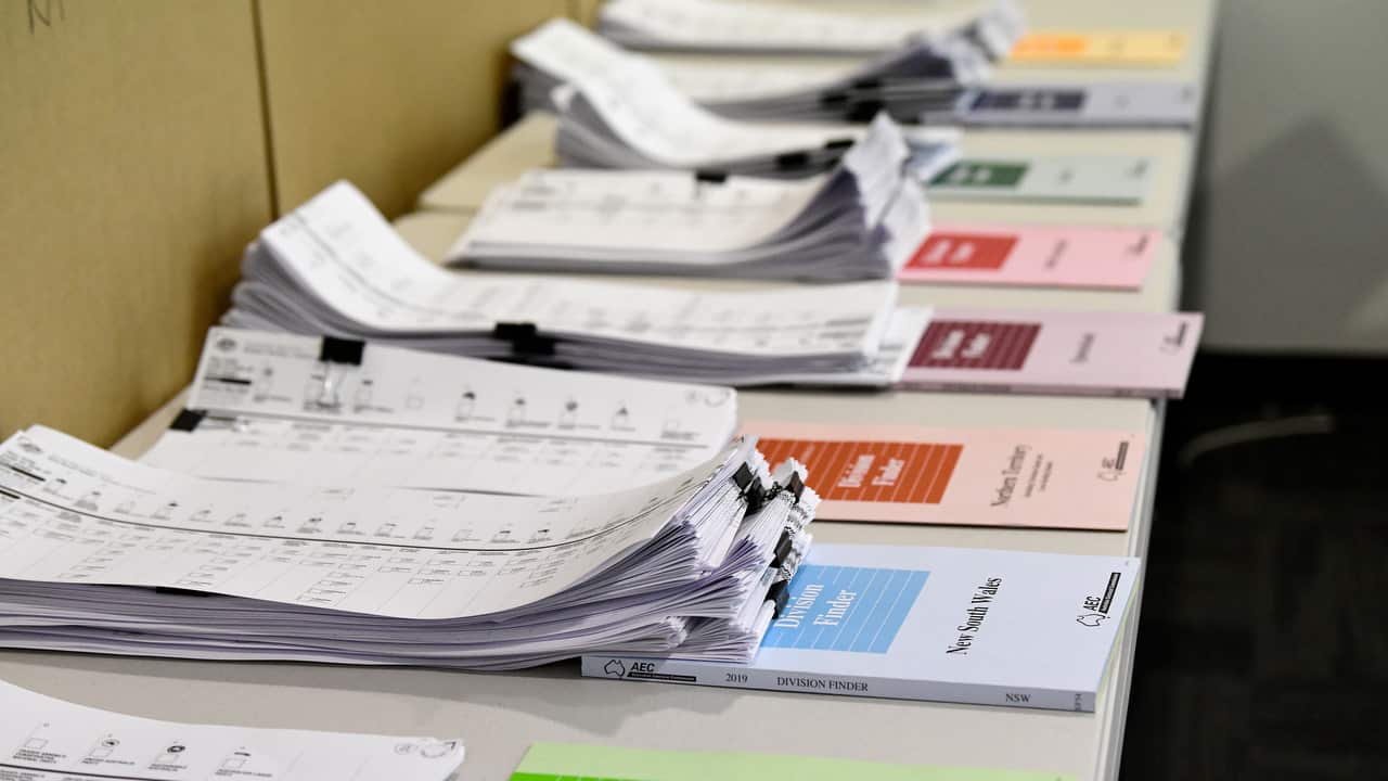 Australian Electoral Commission Division Finder books are seen at a pre-pooling booth in Sydney.
