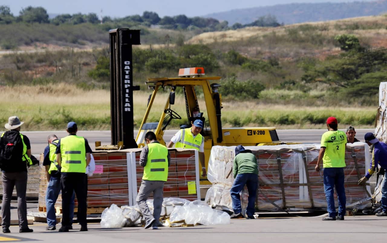 Lester Toledo (C), coordinator of humanitarian aid for Venezuela, speaks speaks at the arrival of three C-17 cargo planes of the US Air Force lands in Colombia.