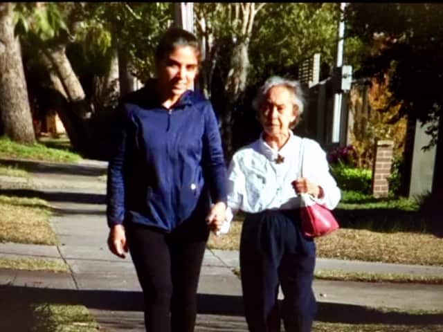 Carer Sukhjeet Watwal and Ivy Anderson enjoy long walks around the neighbourood.