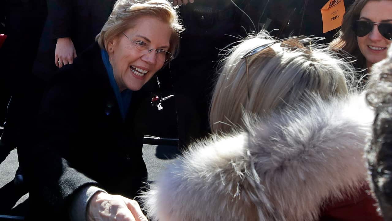 Senator Elizabeth Warren greets a supporter during an event to formally launch her presidential campaign.