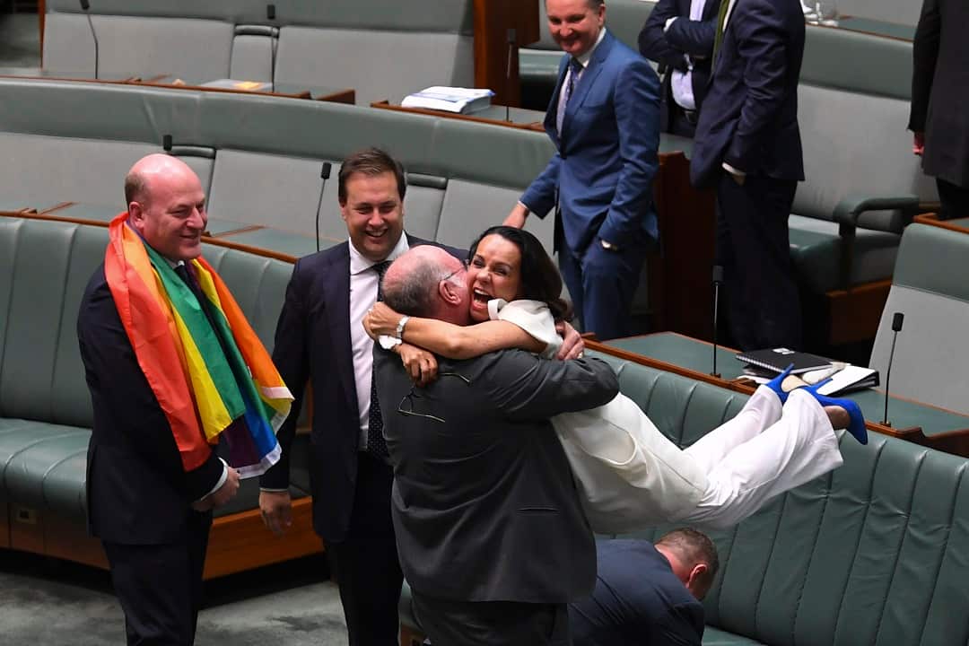 Linda Burney hugs Liberal MP Warren Entsch as they celebrate the passing of the Marriage Amendment Bill on 28 November 2017. 