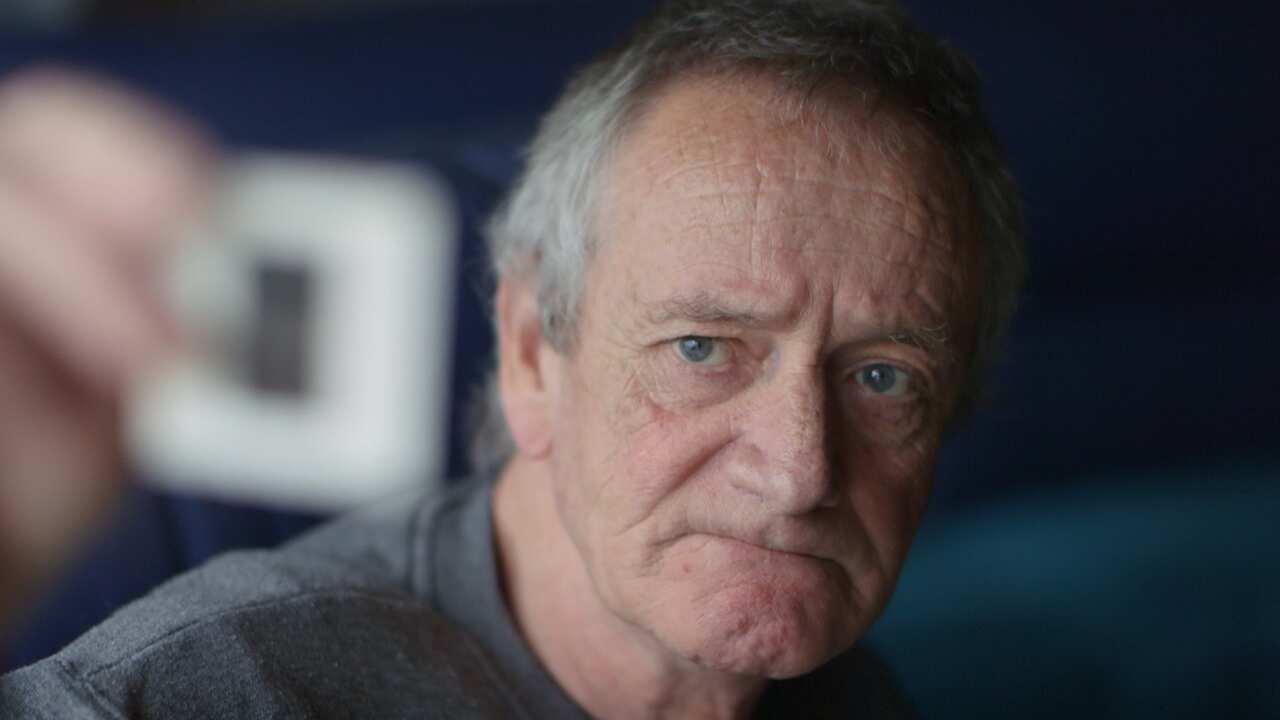 Wayne Davis with his only picture of partner Bill Rooney, who he believes was murdered because he was gay.