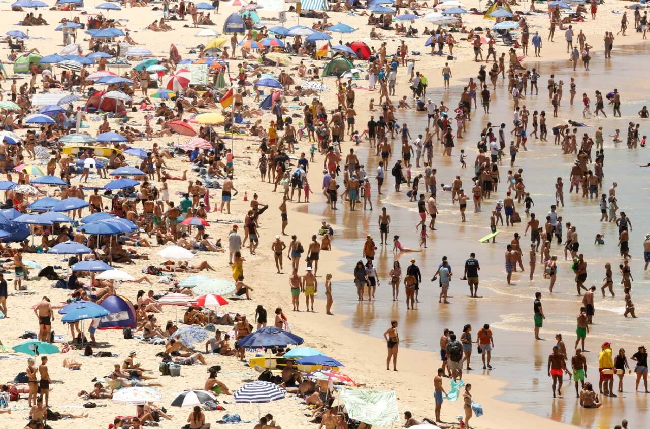 Beachgoers are seen on Bondi beach in Sydney, Sunday, January 7, 2018.