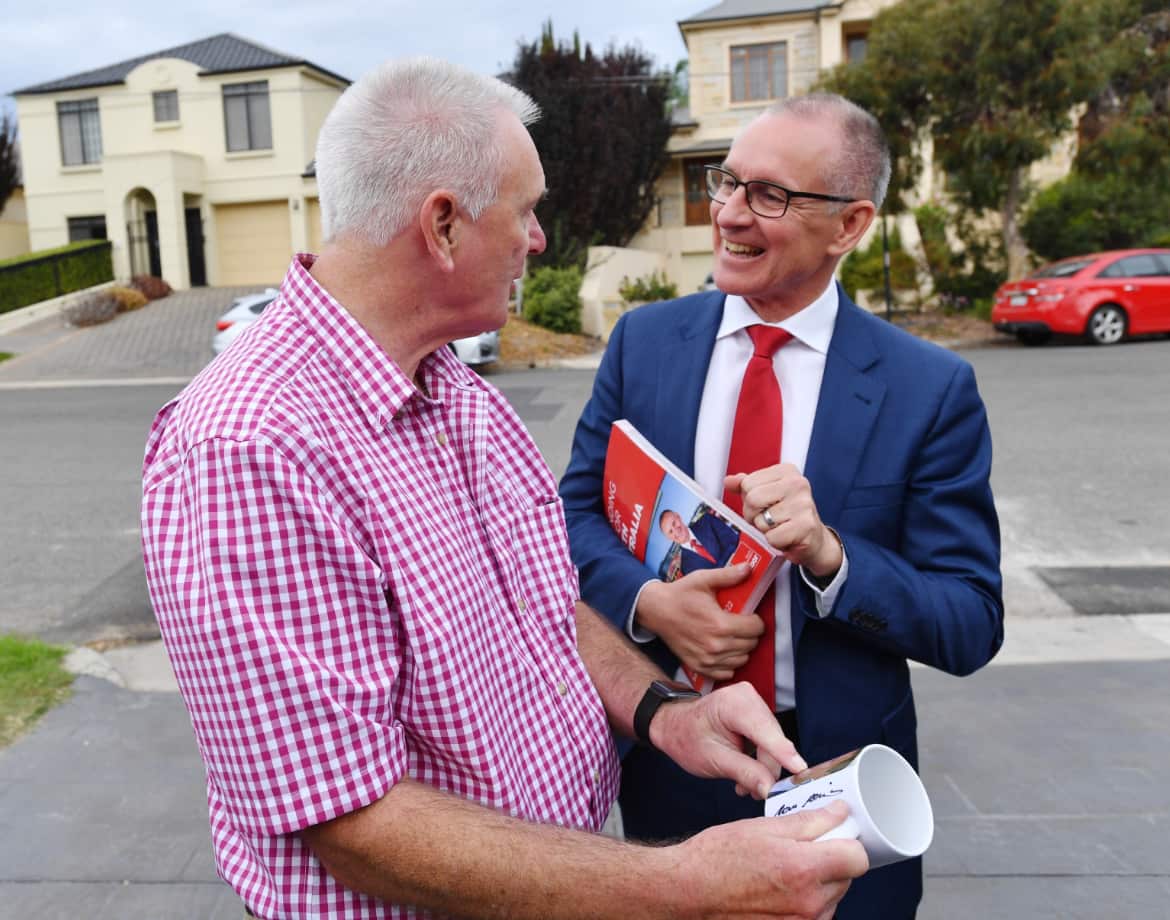 Labor Premier Jay Weatherill talks to a supporter on the final day of the campaign. 