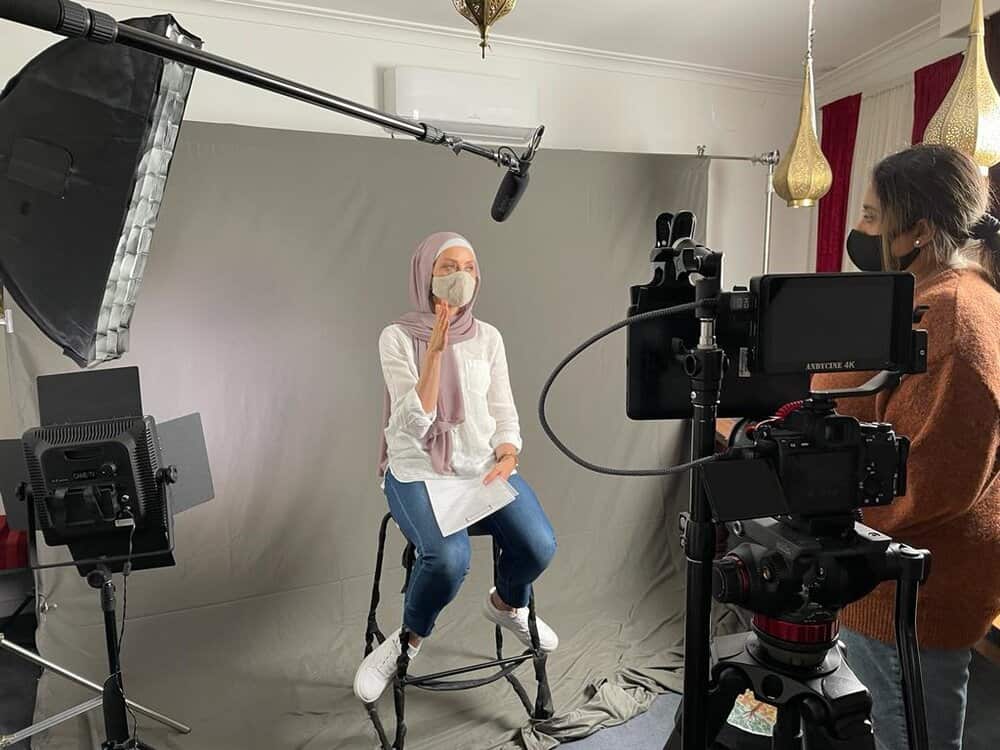 A behind the scenes photo from the filming of the SistaHub's vaccination campaign.