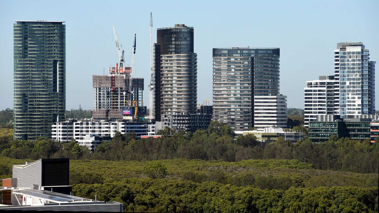 The Opal Tower (left) is seen at Sydney Olympic Park in Sydney, Monday, December 25, 2018.