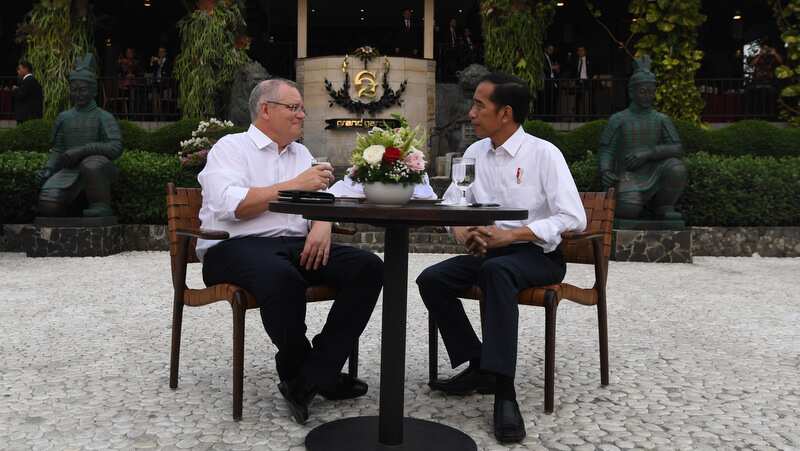 Scott Morrison and Joko Widodo sit down for high tea at the Grand Garden near Bogor Presidential Palace in August 2018.