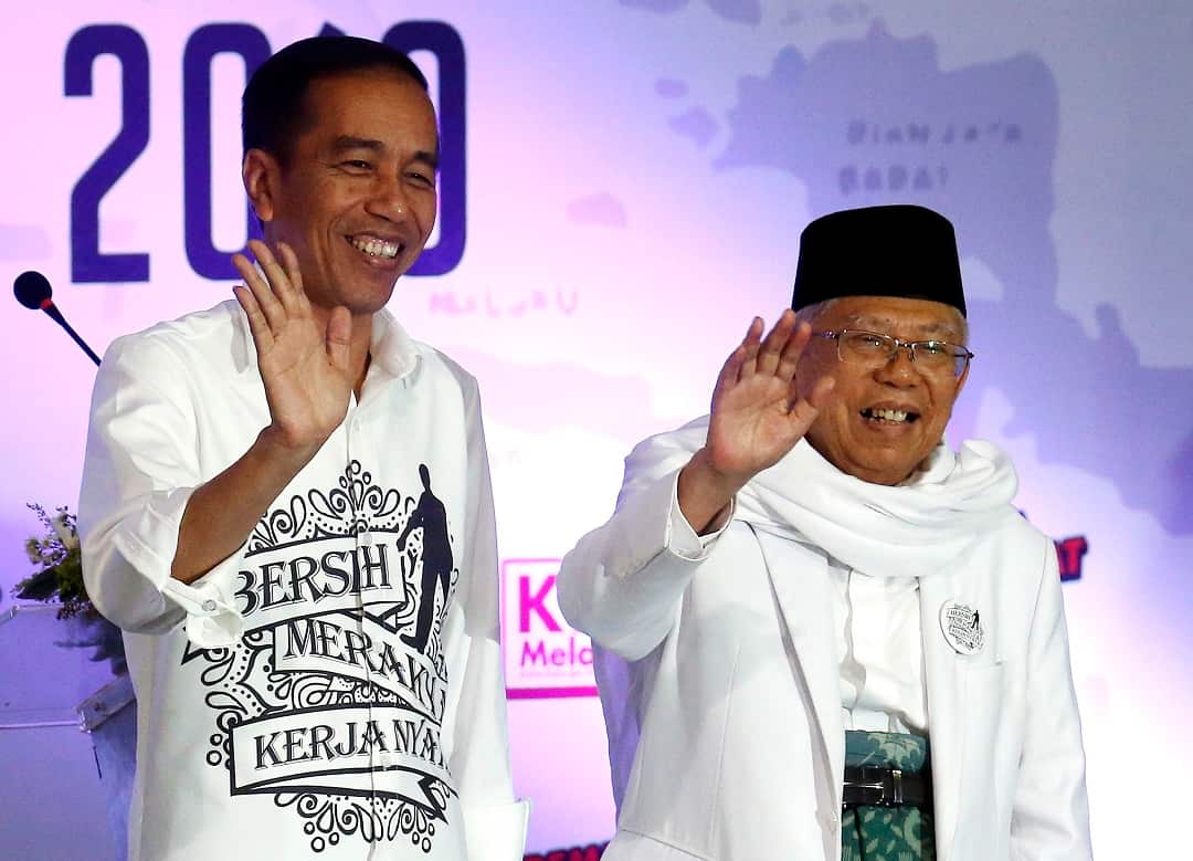 MUI chairman Ma'ruf Amin (L) is President Joko Widodo's running mate for the April 2019 elections. 