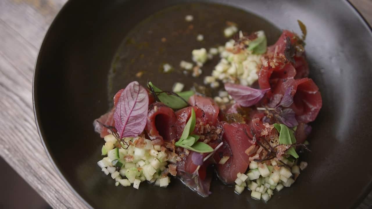 Local yellowfin tuna sashimi dressed with the produce Nick had foraged.
