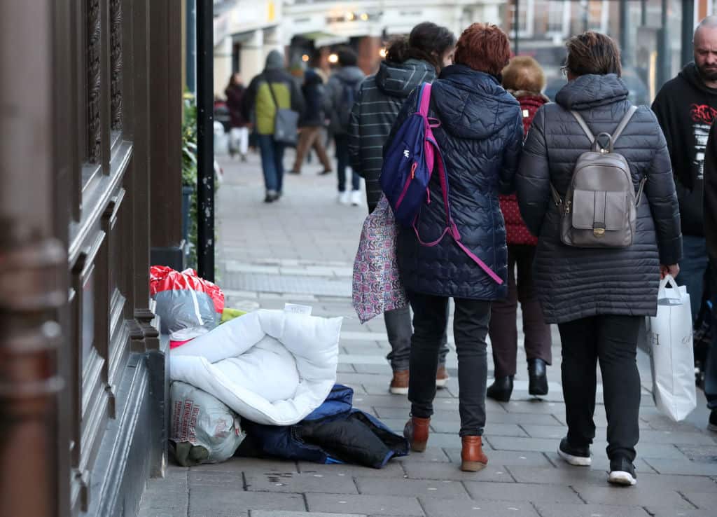 A homeless person sleeps rough near Windsor Castle, Berkshire. Tory council leader Simon Dudley called on police to clear rough sleepers from Windsor.