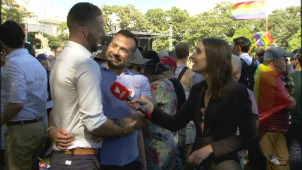 Couple Marcel de Vere and Rob Novotny speaking to SBS News