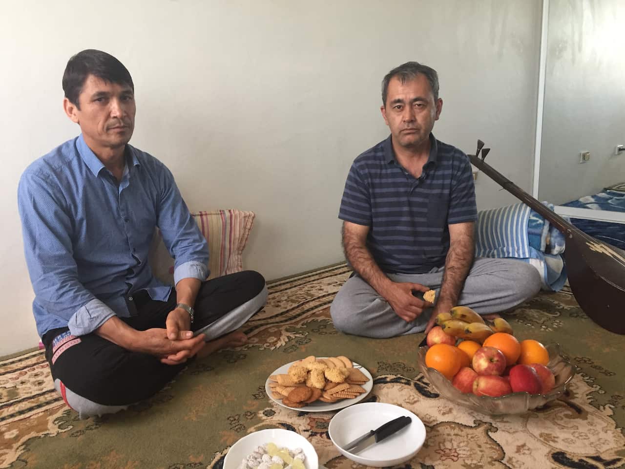 Hafizullah lives with fellow Hazara, Ghulam, (R) in Blacktown, in Sydney's west.