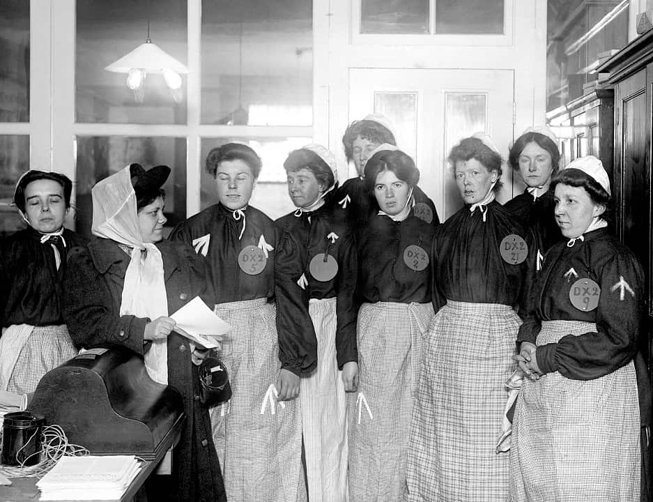 Flora Drummond (left) in 1908 giving instructions to suffragettes dressed as prisoners. 