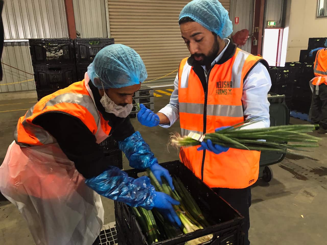 Barinder Puri and staff member