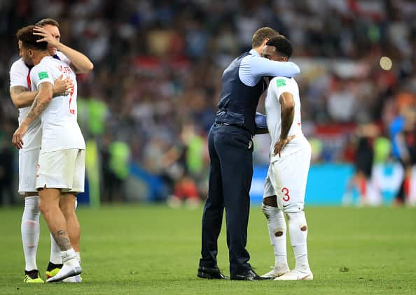 England manager Gareth Southgate embraces Danny Rose after the loss.