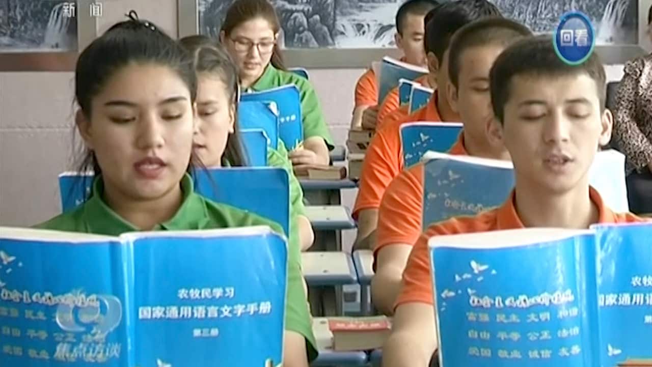 Young Muslims read from official Chinese language textbooks in classrooms at the Hotan Vocational Education and Training Center in Hotan, Xinjiang.