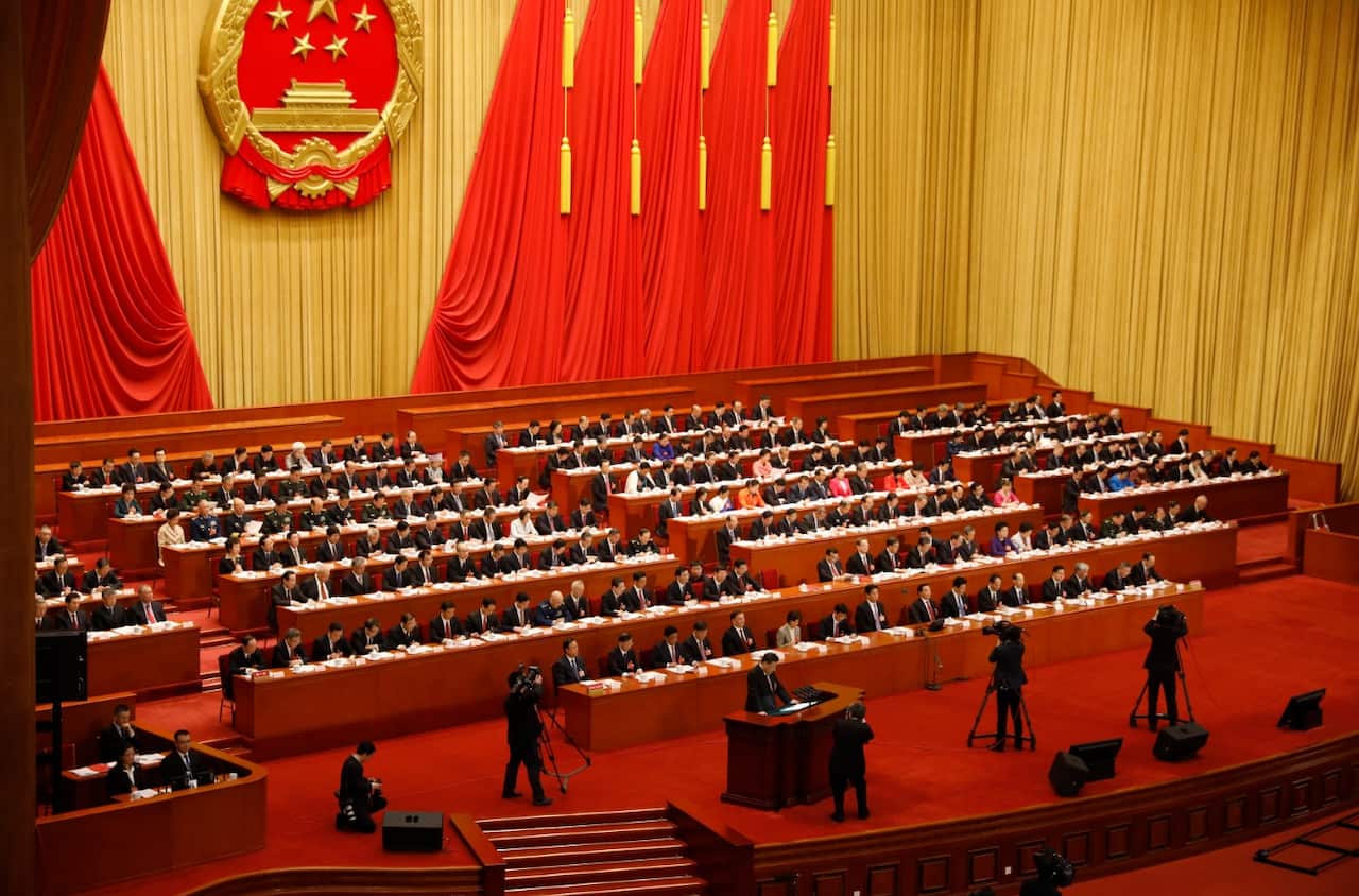 Chinese President Xi Jinping (C, front) delivers his speech during the closing of the first session of the 13th National People's Congress (NPC)