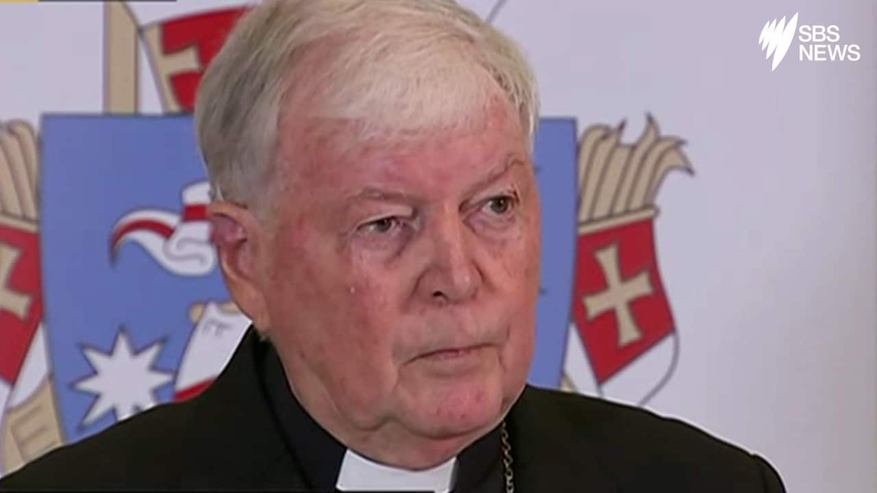 Bishop O'Kelly faces the media.