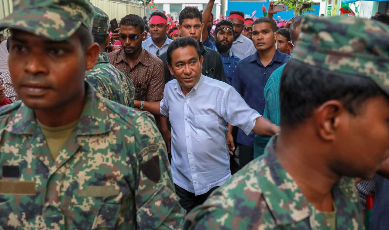 Maldivian president Yameen Abdul Gayoom, center, surrounded by his body guards arrives to address his supporters on Feb 3, 2018. 