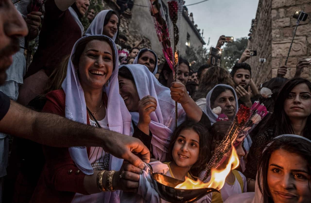 Yazidis gather at the shrine of Sheikh Adi ibn Musafir to celebrate their new year on April 19, 2016 in Mosul (AAP)