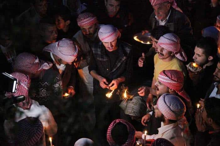 Yazidis gather to mark the New Year, their first since IS militants swept through the area last summer.