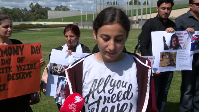 Maryam Solam speaks outside Parliament House, Canberra, Australia.