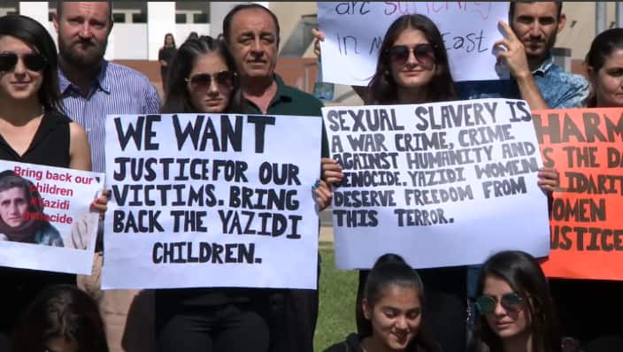 Yazidi supporters campaign outside Parliament House, Canberra.