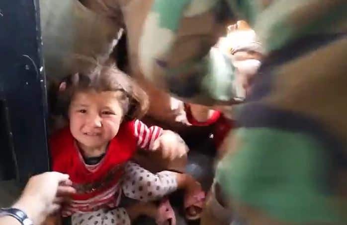 A screenshot from a video by Austrian politician Michel Reimon shows Iraqi Yazidi refugees boarding a helicopter aid flight in Iraq.