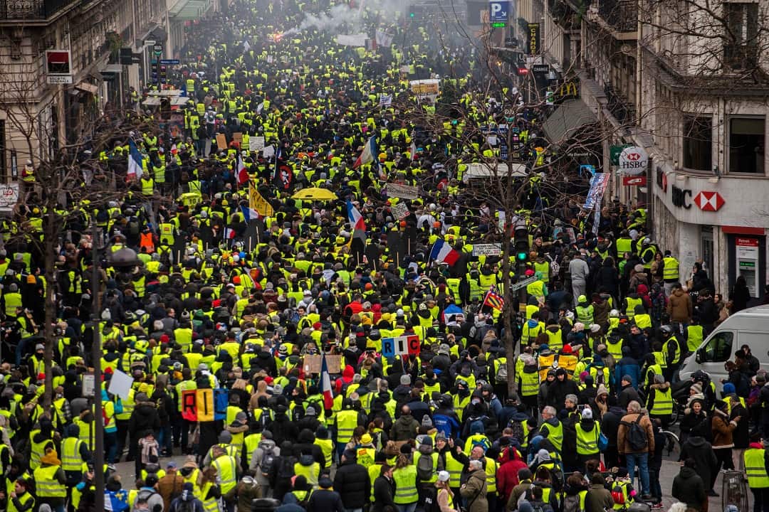 Thousands march in France despite Macron's attempts to channel their anger into a series of public debates. 