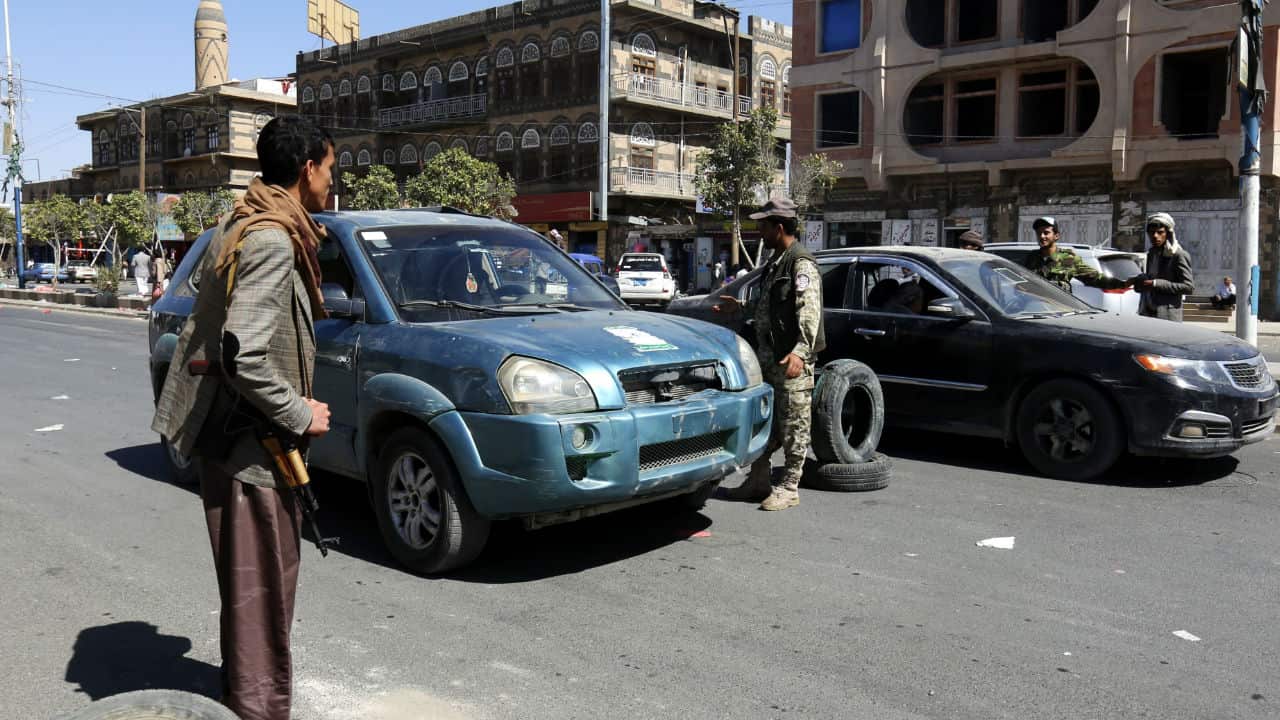 Houthi fighters man a checkpoint amid clashes between the Houthis and forces loyal to former Yemeni president Ali Abdullah Saleh, in Sanaa, Yemen.
