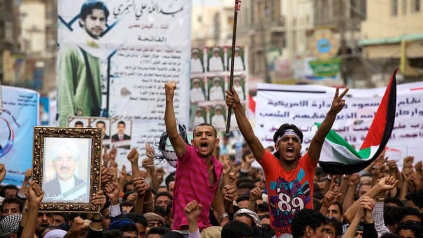 Yemeni anti-government protesters chant slogans during a demonstration demanding the ouster of Yemeni President Ali Abdullah Saleh in Sana'a on 21 June 2011.