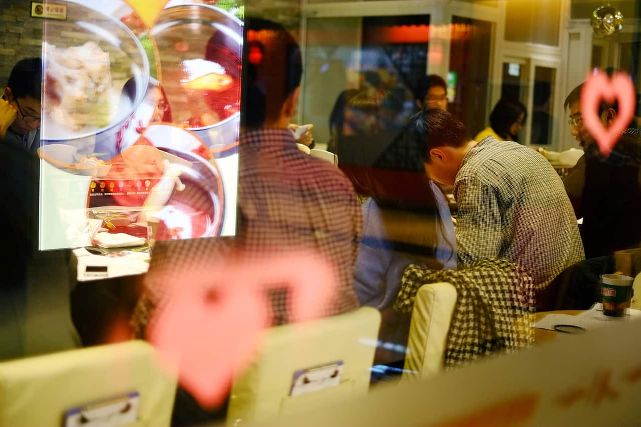 Young Chinese singles attend a match-making hotpot dinner event in Beijing. (Katrina Yu)