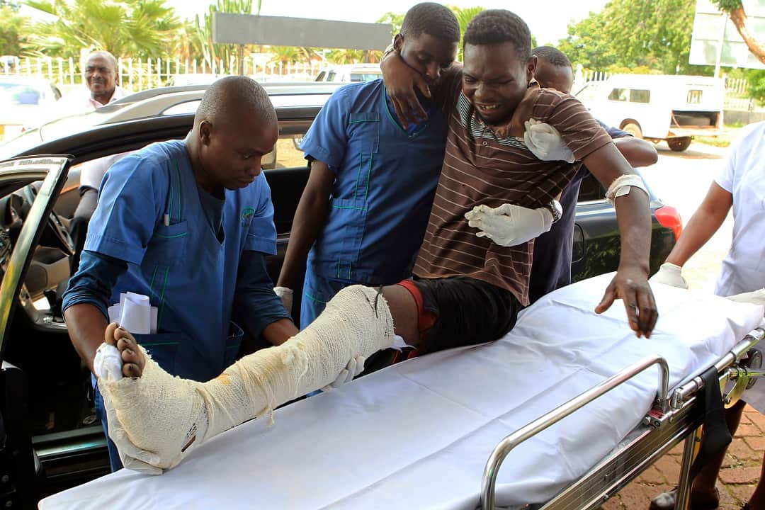 A man who says he was assaulted by a group of uniformed soldiers in Harare, Zimbabwe is recieved at a private hospital. 