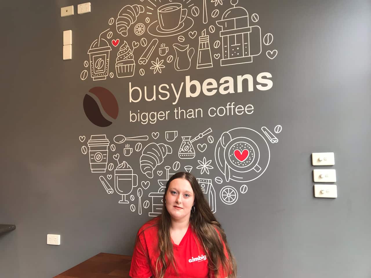 Zoe Justin is training staff in coffee making