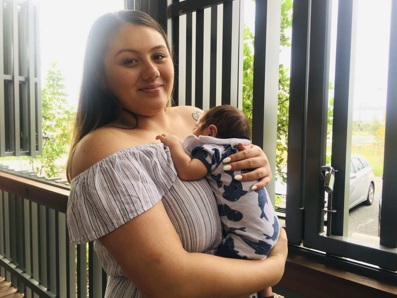 New mum Zian Janes-Paratene with 6-week-old baby Carter.