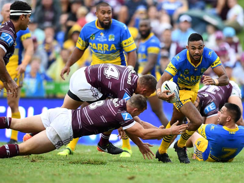 Bevan French of the Eels evades a tackle