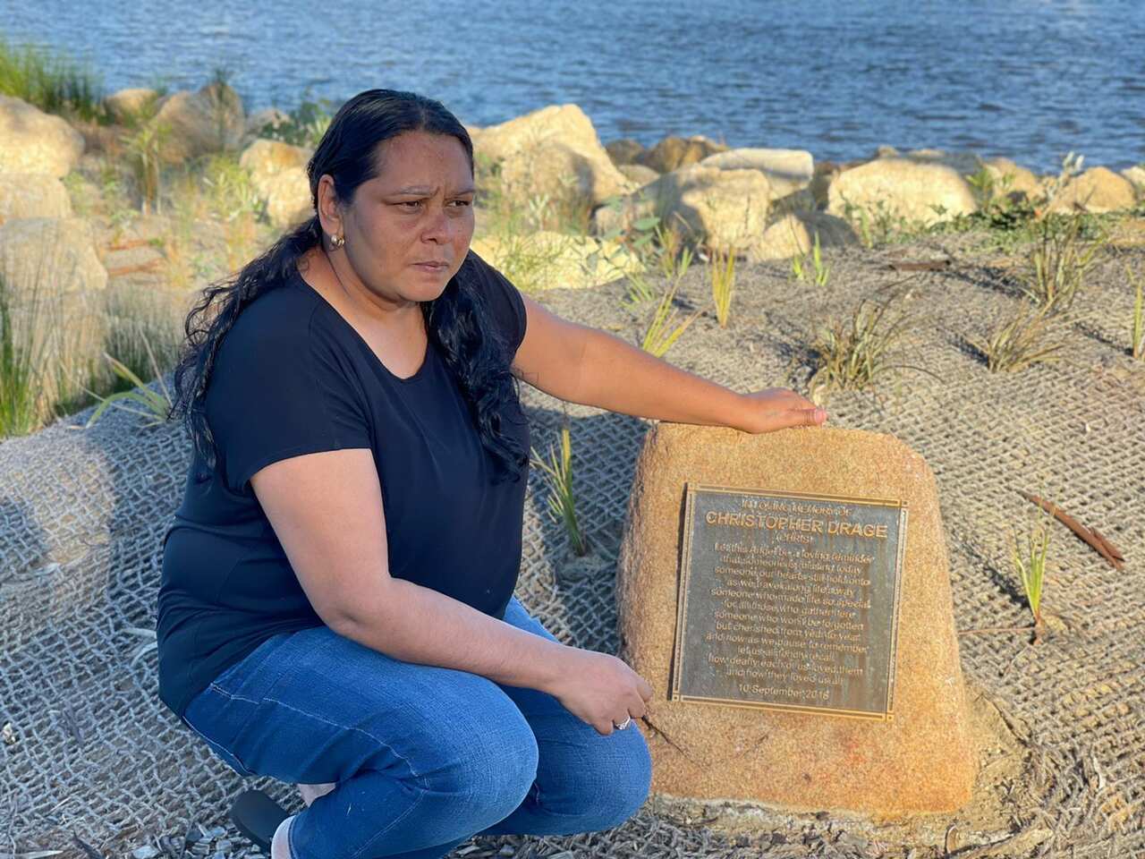 Winnie Hayward by the memorial to her son Chris Drage who drowned after a police pursuit in 2018