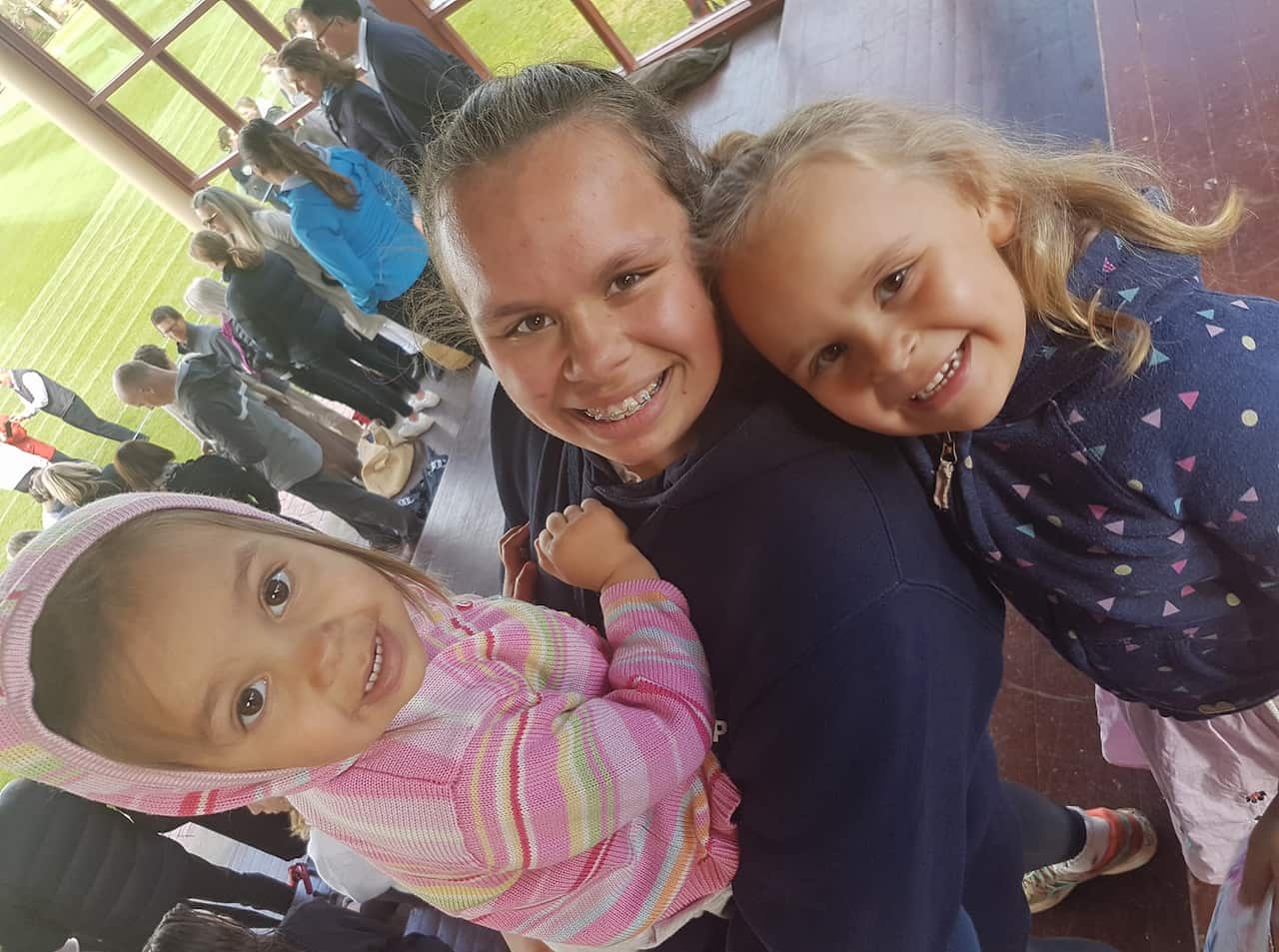 Zoe Walters and her two young sibling smile