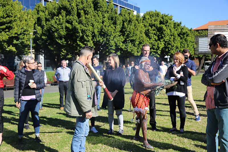 Uncle Max Eulo gives an official smoking ceremony at the launch of Google Australia's RAP