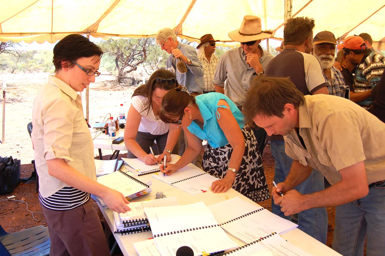Local pastoralists sign the Indigenous Land Use Agreements 